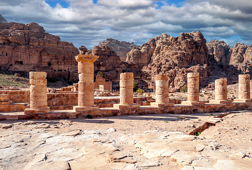 Ruins of the ancient city of Petra in Jordan in a sunny day. Petra is an important archaeological site built with stone.