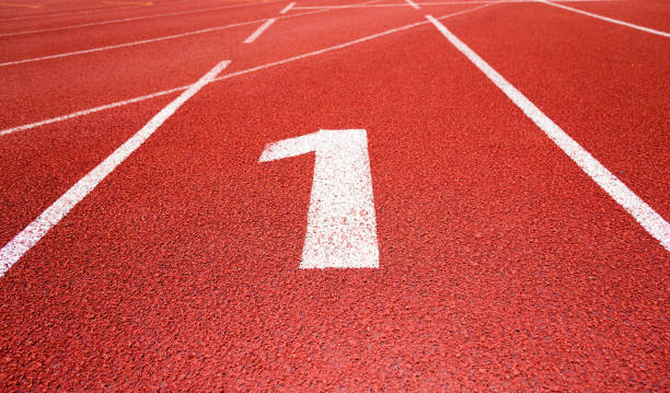 Running track number 1 in sport field Running track number 1 in sport field asien startblock stock pictures, royalty-free photos & images