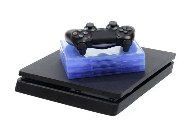 Russia, OKTOBER 24 2019:  Sony Play Station 4 Pro gaming console on the table with  joystick and some games on DVD for PS4. Russia, OKTOBER 24 2019:  Sony Play Station 4 Pro gaming console on the table with  joystick and some games on DVD for PS4. fifa stock pictures, royalty-free photos & images