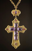 Rare Russian Orthodox Bishop's cross with amethyst stones and rubies.  On a black background.