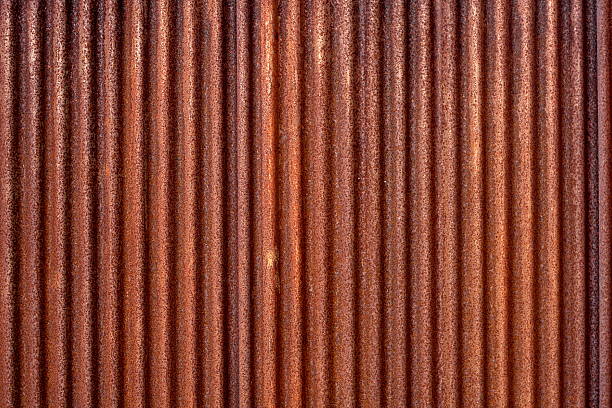 Rusted Corrugated Metal Corrugated metal fencing rusty fence stock pictures, royalty-free photos & images