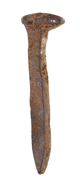 Rusted Iron Stake "Rusted iron stake like used for railroad tracks, isolated on white." spiked stock pictures, royalty-free photos & images