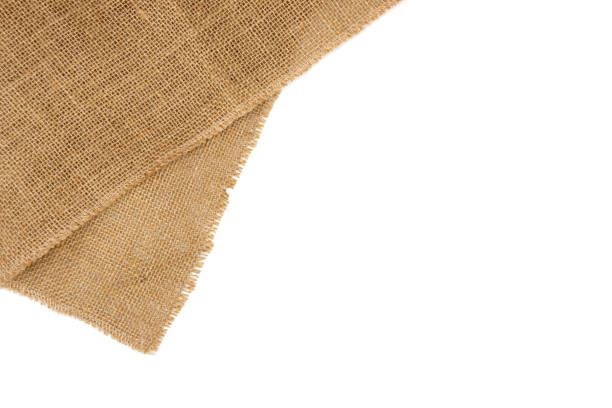 Rustic brown burlap cloth. Rustic brown burlap cloth, isolated on white background. burlap stock pictures, royalty-free photos & images