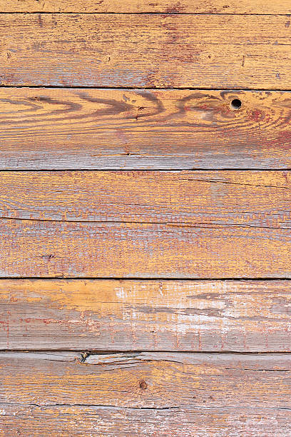 rustic weathered barn wood background with knots and nail holes stock photo