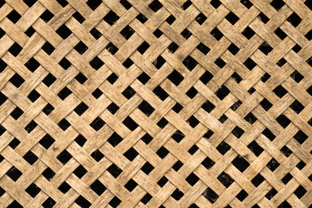 Rustic wooden diagonal lattice. Wood trellis. Wooden netting stock photo