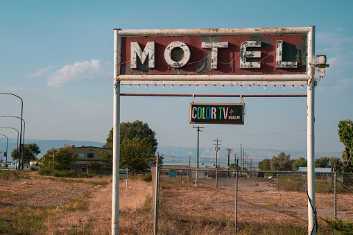 Vernal, Utah - September 20, 2020: Rusty, old motel neon sign, with a vintage color TV by RCA plaque, taken in fall