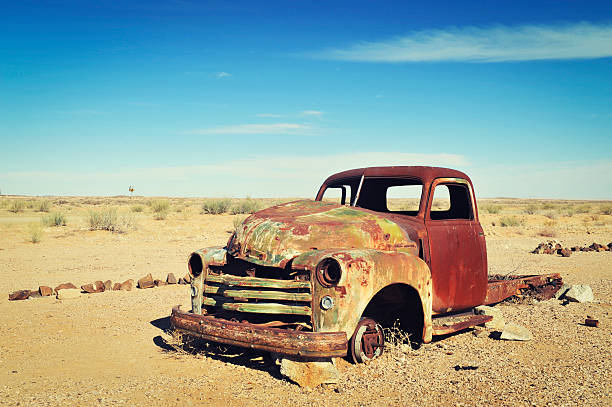 Rusty old wreck abandoned in the Namibia Desert stock photo
