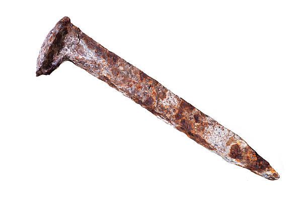 Rusty Railroad Spike- Isolated on white Rusty railroad spike isolated on white background. spiked stock pictures, royalty-free photos & images