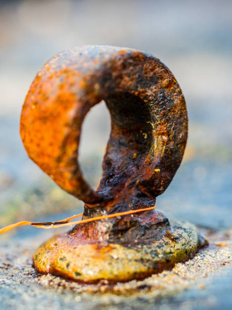 Rusty steel hoop Old rusty steel hoop used as an anchor point anchor point stock pictures, royalty-free photos & images
