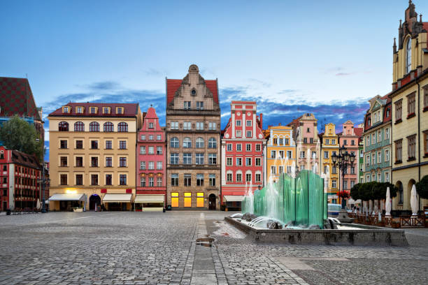 Rynek square with old colorful houses and fountain in Wroclaw Rynek square with old colorful houses and fountain in Wroclaw, Poland wroclaw stock pictures, royalty-free photos & images