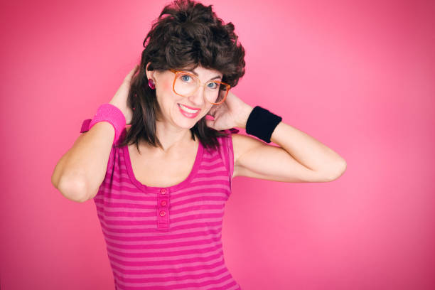 80's Mullet Model A humorous image of a woman dressed in 80's fashion including the popular mullet hairstyle. mullet haircut photos stock pictures, royalty-free photos & images