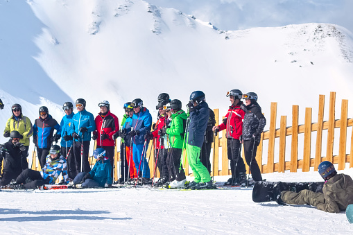 Saalbach-Hinterglemm, Austria - March 6, 2020: Skiers and snowboarders ready for skiing from top ski lift station