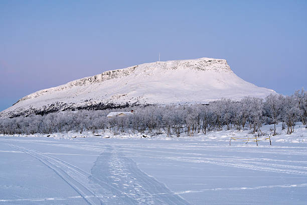 Saana hill in winter, Finnish Lapland, Finland View of Saana hill from Kilpisj kilpisjarvi lake stock pictures, royalty-free photos & images