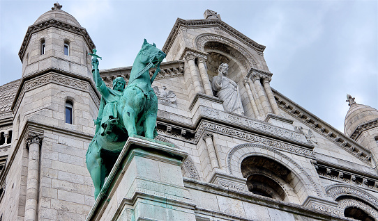 Low angle shot of the statuary one the facade of Sacre Coeur Basilica in Montmartre, Paris