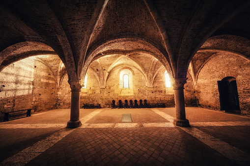 Illuminated sacred place in an old abbey (San Galgano, Tuscany).
