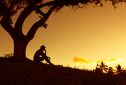 Sad And Lonely Man Sitting Alone Under A Tree Stock Photo Download Image Now Istock