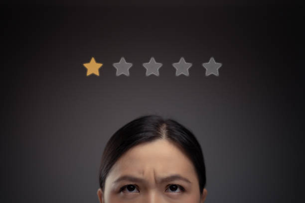 Sad Asian woman and star icon hologram effect. stock photo