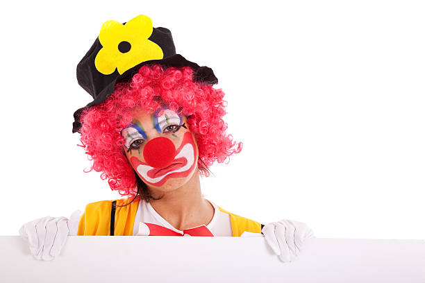 sad clown holding a banner stock photo