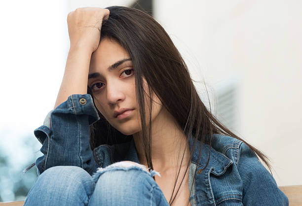 Sad girl Sad Young hispanic girl looking at the camera mexican teenage girls stock pictures, royalty-free photos & images