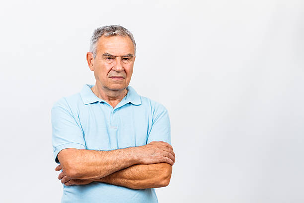 Royalty Free Angry Frowning Grumpy Middle Age Man With Arms Folded