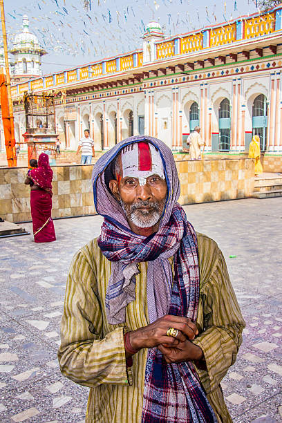sadhu at Janaki Mandir Janakpur, nepal - March 19, 2014: A Sadhu, a holy man in Hinduism at Janaki Mandir. The temple was buildt in 1911 AD, and is considered as the most important example of the Rajput architecture in Nepal.  It is dedicated to goddess Sita. terai stock pictures, royalty-free photos & images