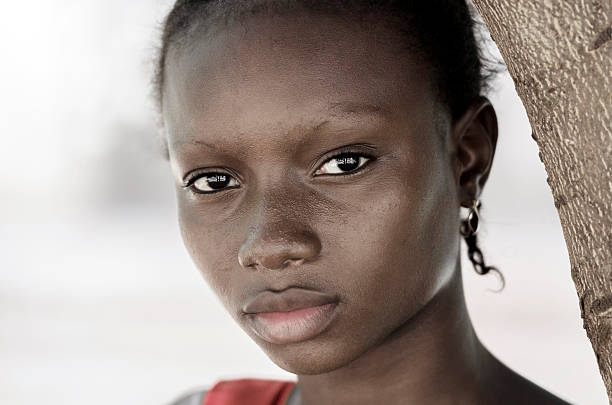 Sadness Poverty Symbol - African Black Girl Symbol stock photo