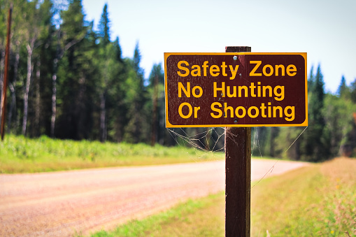 A Safety Zone, No Hunting or Shooting sign