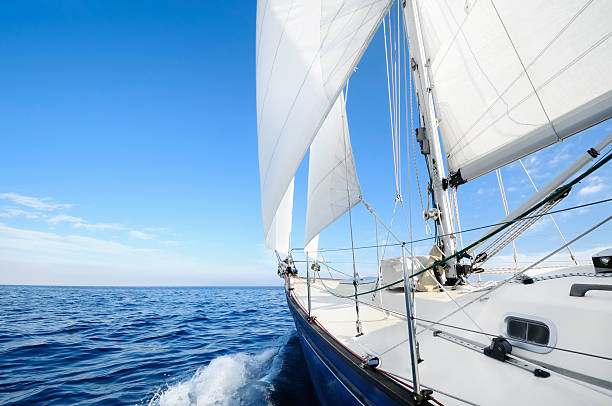 sail boat in the middle of the ocean - segelbåt bildbanksfoton och bilder
