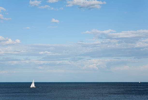 Sailboat and Wide Expanse of Ocean stock photo