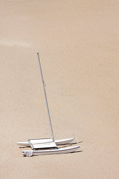 Sailboat on beach stock photo