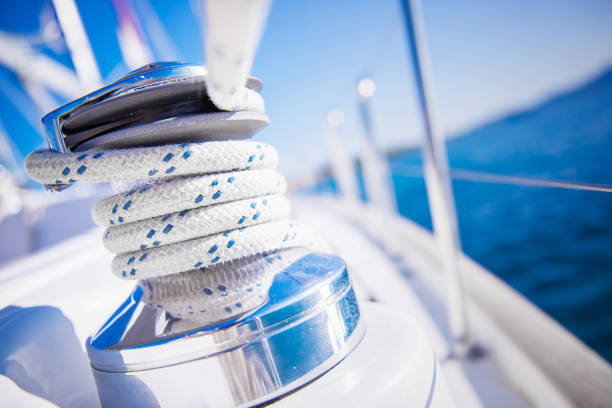 Sailboat winch and rope yacht detail. Yachting stock photo