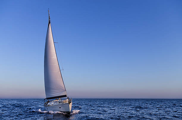 Sailing in the dusk in the Aegean sea, Greece stock photo