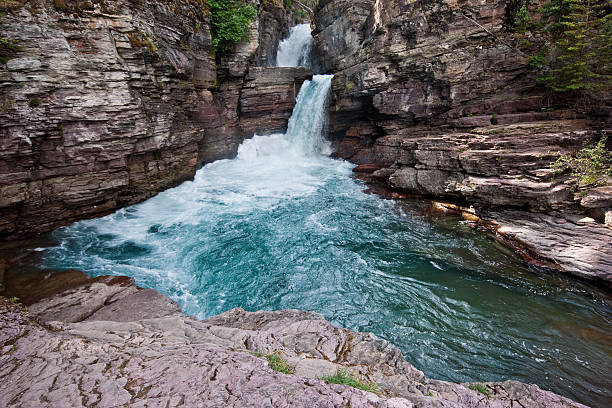 Saint Mary Falls Saint Mary Falls is one of the more spectacular falls on the Saint Mary River which flows into Saint Mary Lake. Saint Mary Falls is near the Going to the Sun Road in Glacier National Park, Montana, USA. jeff goulden waterfall stock pictures, royalty-free photos & images