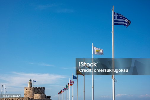 istock Saint Nicholas fortress and lighthouse in Mandraki Harbour at Rhodes, Greece 1413324632