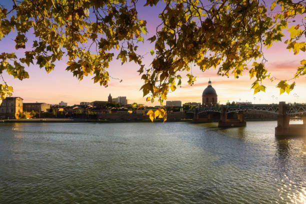 Saint-Pierre bridge reflecting in Garonne river and Dome de la Grave in Toulouse, France stock photo