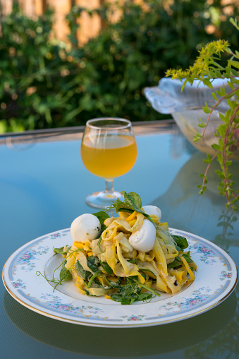 Ingredients - yellow zucchini, pea leaves and bocconcini cheese