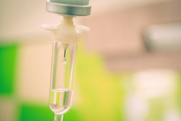 Saline solution drip for treatment patient in the hospital.  infusion therapy stock pictures, royalty-free photos & images