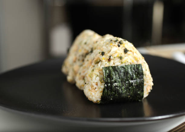 Salmon and pickle onigiri stock photo