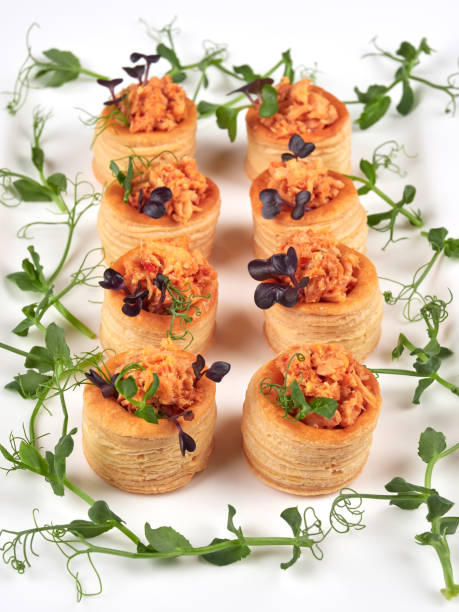 Salmon filled puff pastries or vol-au-vent stock photo