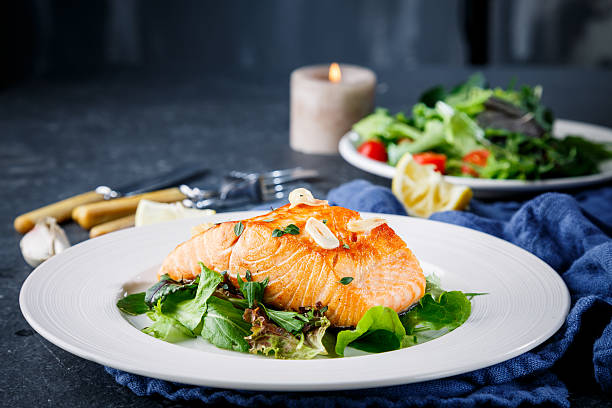 salmon fish on white plate - tallrik med fisk bildbanksfoton och bilder
