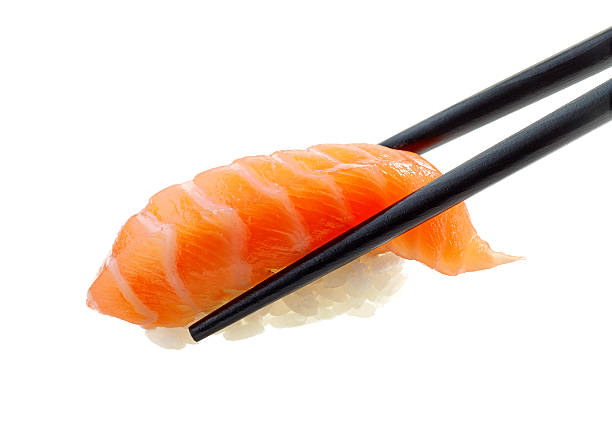 Salmon sushi Salmon sushi isolated on white background chopsticks stock pictures, royalty-free photos & images