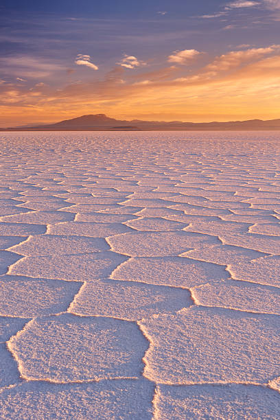 Salt flat Salar de Uyuni in Bolivia at sunrise stock photo