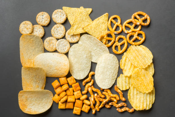 Salty snacks. Pretzels, chips, crackers Salty snacks. Pretzels, chips, crackers cracker snack photos stock pictures, royalty-free photos & images
