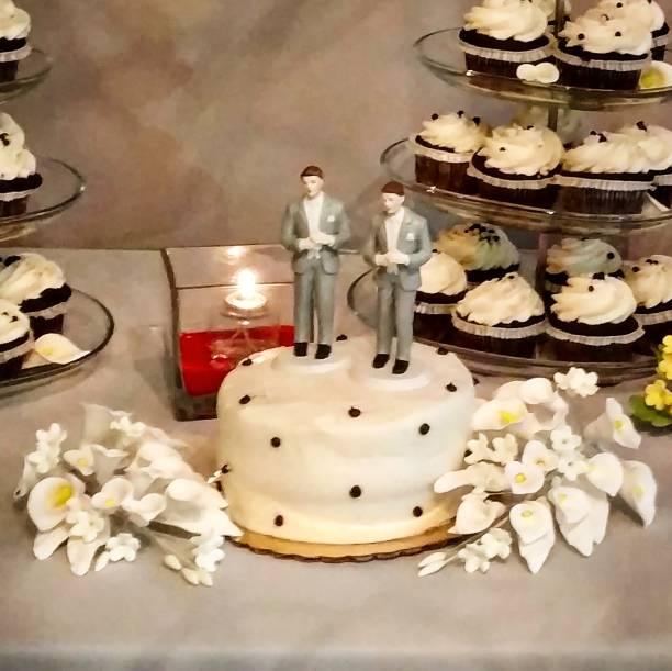 Same-Sex Wedding Cake and Cupcakes stock photo