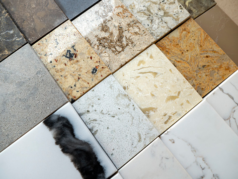 A sample of decorative artificial stone. Natural stone texture for kitchen countertops and floors. Finishing materials.
