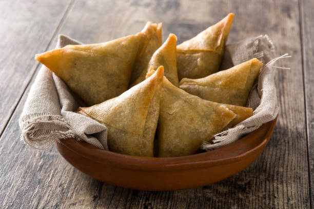 Samsa or samosas with meat and vegetables stock photo