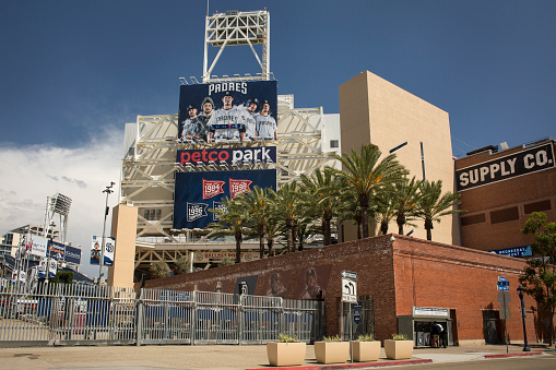 San Diego, California: Horizontal shot of the Petco Park (San Diego Padres baseball Park) exterior with billboards of players’ photographs, Tony Gwynn Drive, East Village
