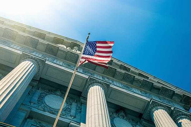 San Francisco City Hall entrance San Francisco City Hall entrance seen from below with a national flag. government building stock pictures, royalty-free photos & images