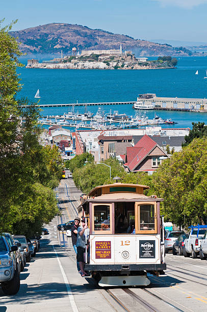 San Francisco iconic cable car with tourists California USA stock photo