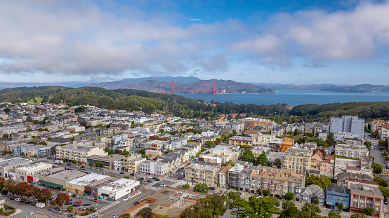 High quality aerial stock photo of the Laurel Heights neighborhood and the Golden Gate Bridge in San Francisco, California.
